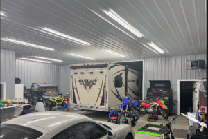 RV and dirt bikes inside finished garage