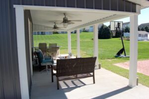 porch area with chairs and ceiling fans