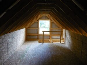 attic space with window and stairs